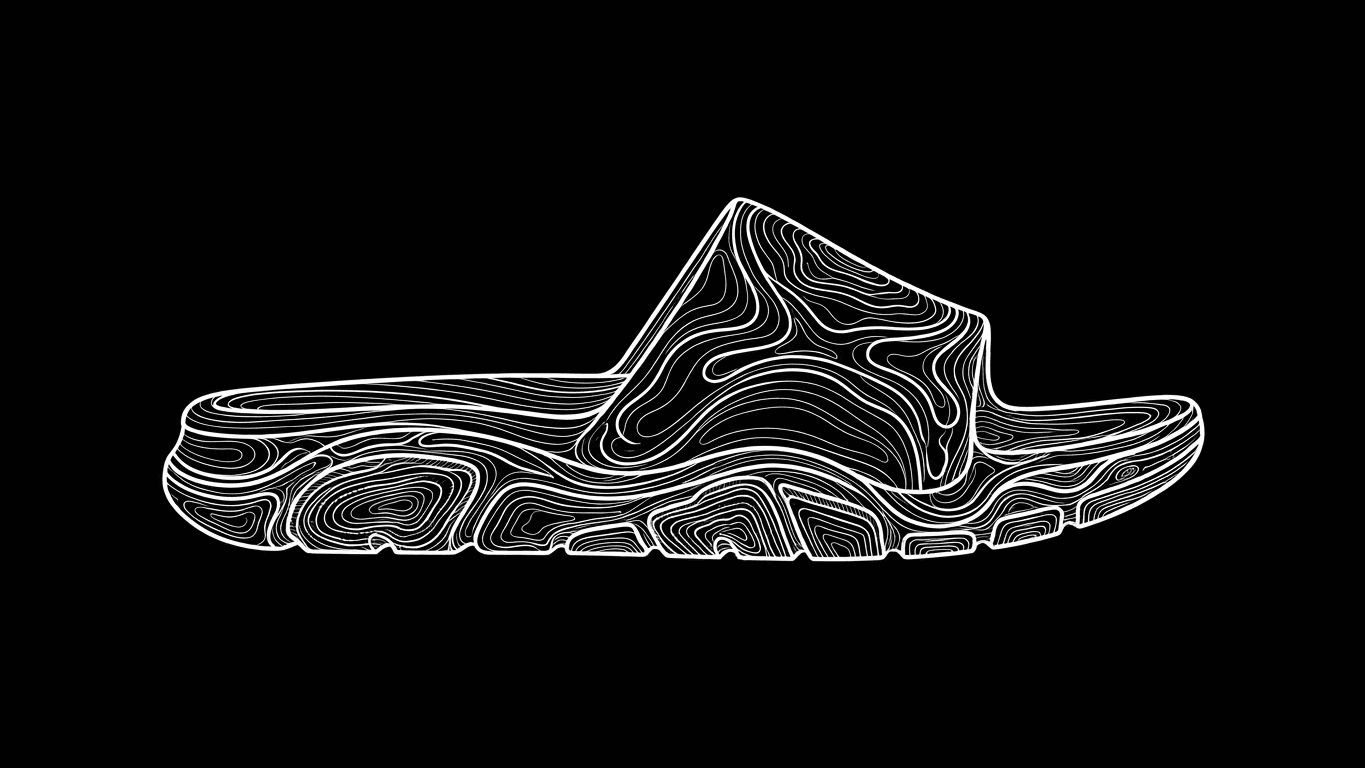 Side profile of a sports slide showing a contoured footbed and a thick patterned sole.
